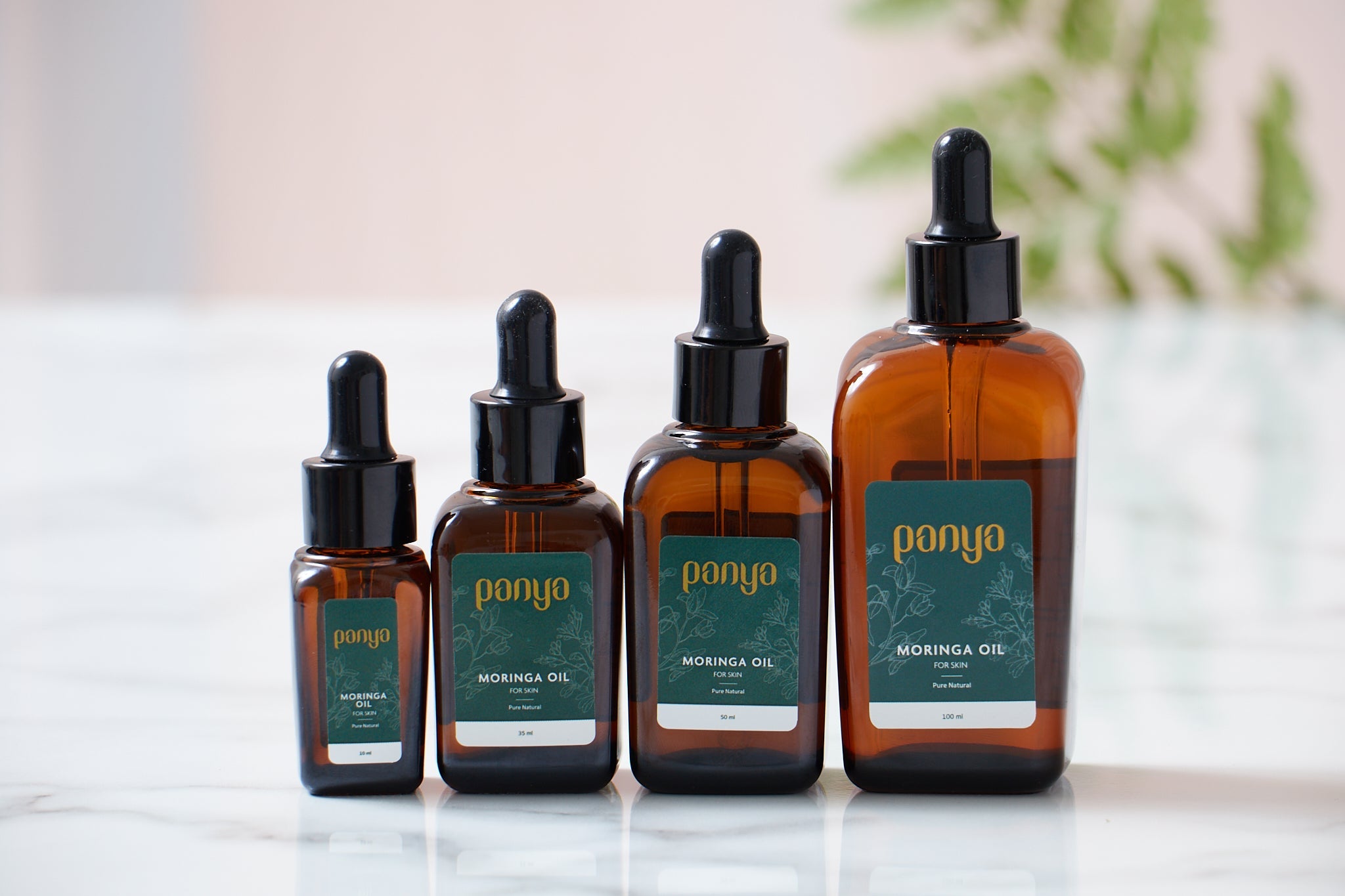 Panya 100% Moringa Oil: vegan Thai-grown cold-pressed virgin moringa oil with 46 antioxidants for strong, smooth skin. 
