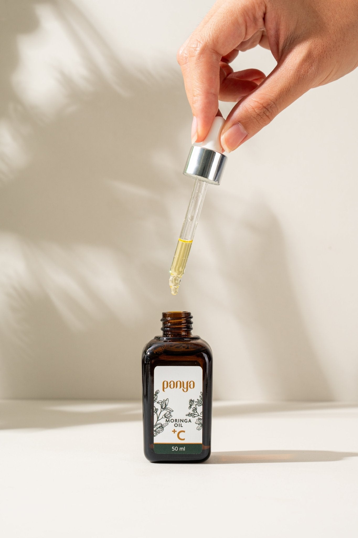 Panya 100% Moringa Oil + Vitamin C: vegan, anti-aging Thai moringa oil with brightening, reparative, antioxidant infusion.
