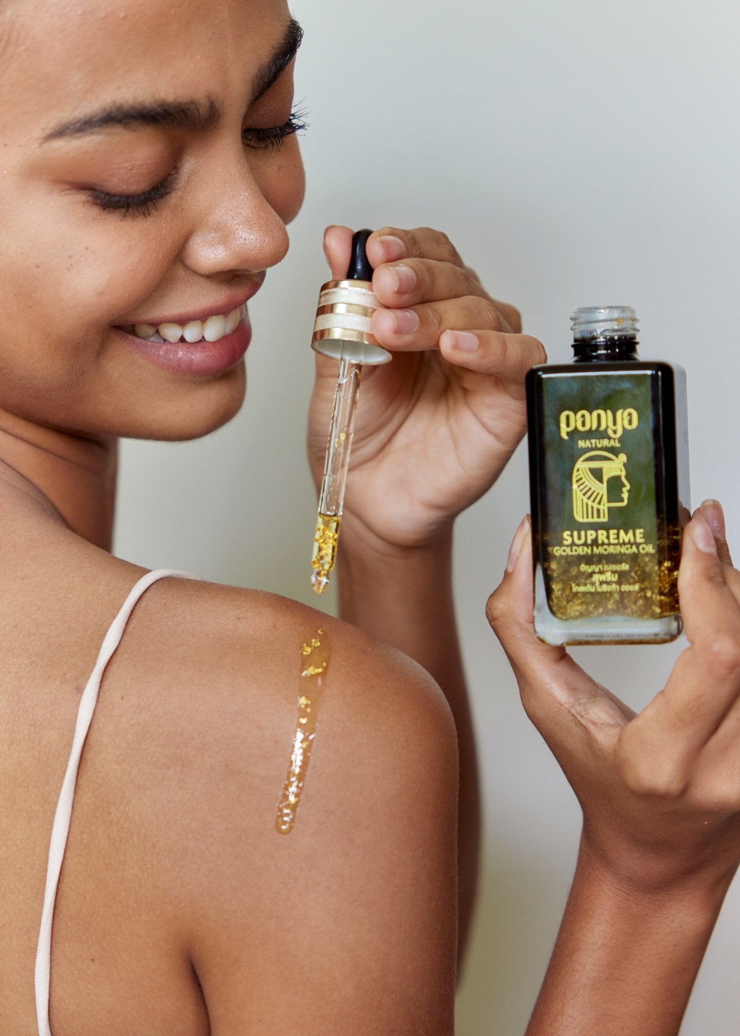 Panya Supreme Golden Moringa Oil: organic, concentrated rejuvenation with 24k gold, Thai moringa & other premium essential oils.